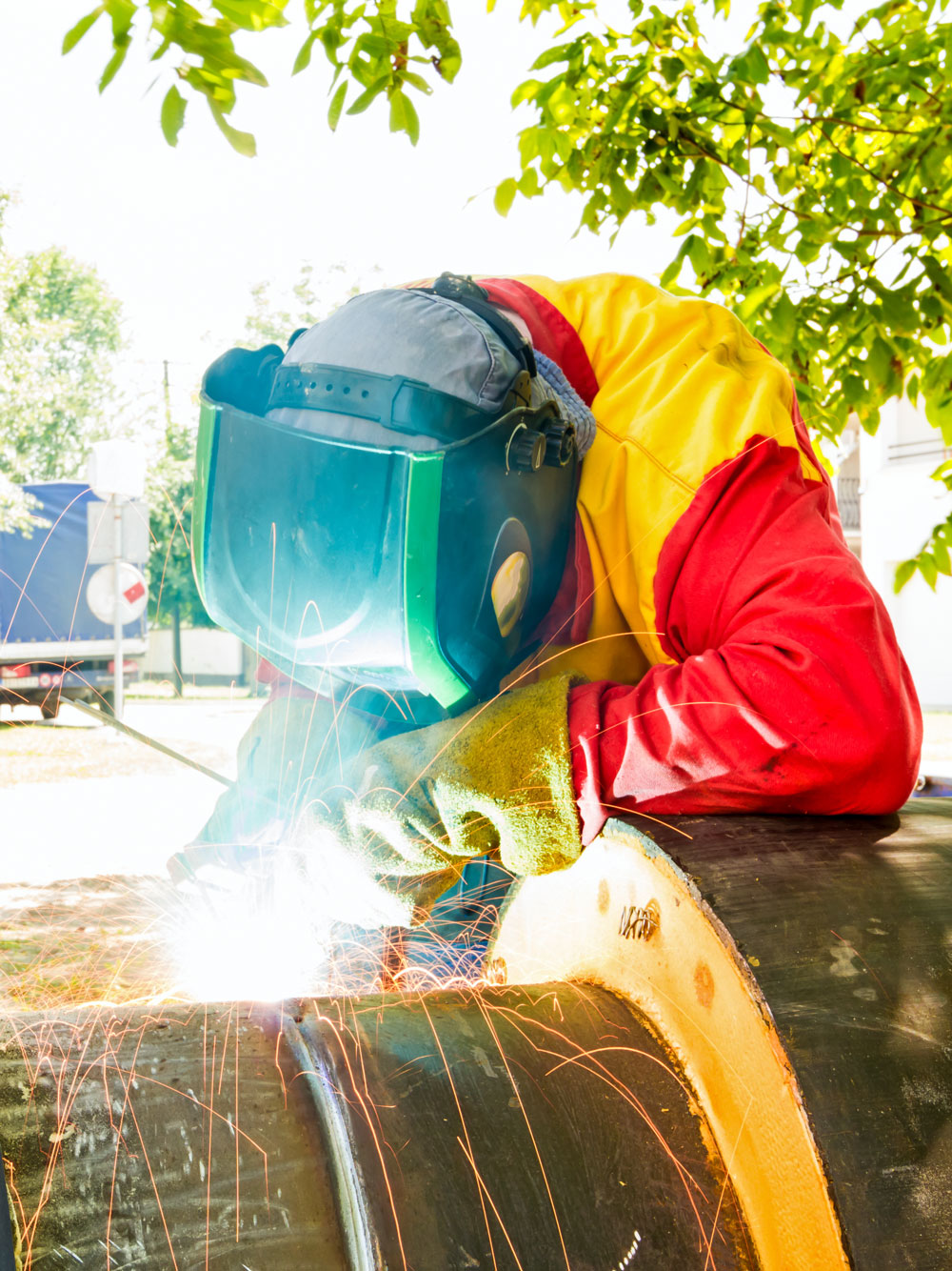 A Protege employee performing welding work